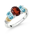 thumbnail image 1 of Gem Stone King 925 Sterling Silver and 10K Yellow Gold Oval Red Garnet Blue Zircon and White Diamond 3 Stone Ring for Women (2.83 Cttw, Gemstone January Birthstone, Size 6), 1 of 3
