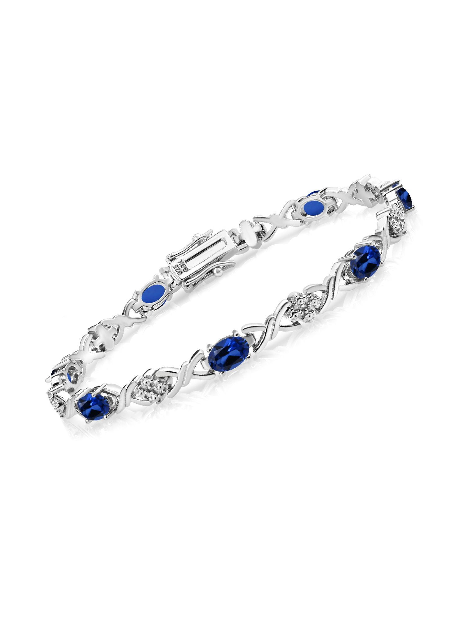 Gem Stone King 925 Sterling Silver Blue Created Sapphire Tennis Bracelet for Women (4.80 Cttw, Gemstone September Birthstone, Oval 6X4MM, 7 inch)