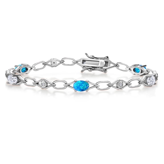 Gem Stone King 925 Sterling Silver Blue Simulated Opal and White Moissanite and Round White Lab Grown Diamond Tennis Bracelet for Women (3.04 Cttw, Gemstone Birthstone, Oval 6X4MM, 7.25 inches)