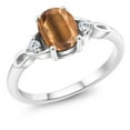 thumbnail image 1 of Gem Stone King 925 Sterling Silver Brown Tiger Eye and White Moissanite 3-Stone Rings for Women (1.33 Cttw, Gemstone, Oval 8X6MM, Available in Size 5, 6, 7, 8, 9), 1 of 4