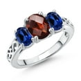 thumbnail image 1 of Gem Stone King 925 Sterling Silver Red Garnet and Blue Created Sapphire Filigree Style 3 Stone Ring for Women (2.73 Cttw, Oval 8X6MM and 6X4MM) (Size 6), 1 of 6