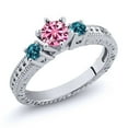 thumbnail image 1 of Gem Stone King 925 Sterling Silver 3-Stone Ring Round Pink Moissanite and Topaz London Blue (0.76 Cttw, Size 6), 1 of 2