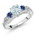 thumbnail image 1 of Gem Stone King 925 Sterling Silver Sky Blue Aquamarine Blue Created Sapphire and White Moissanite Engagement Ring for Women (1.30 Cttw, Gemstone March Birthstone, Round 6MM and 3MM, Size 5), 1 of 4