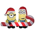 thumbnail image 1 of Gemmy Christmas Airblown Inflatable Minions Carrying Candy Cane Scene Universal, 4 ft Tall, 1 of 2