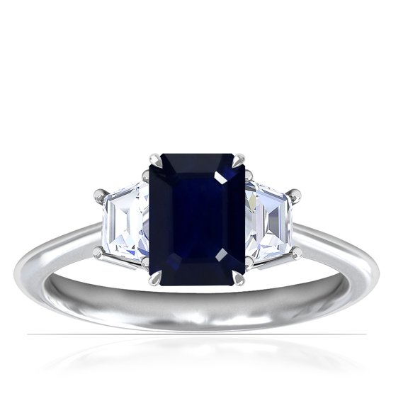 GemsNY September Birthstone - Three Stone Ring Emerald Cut Blue Sapphire with Prong Set Trapezoid Side Diamonds (Grade - A | 1.20cttw)