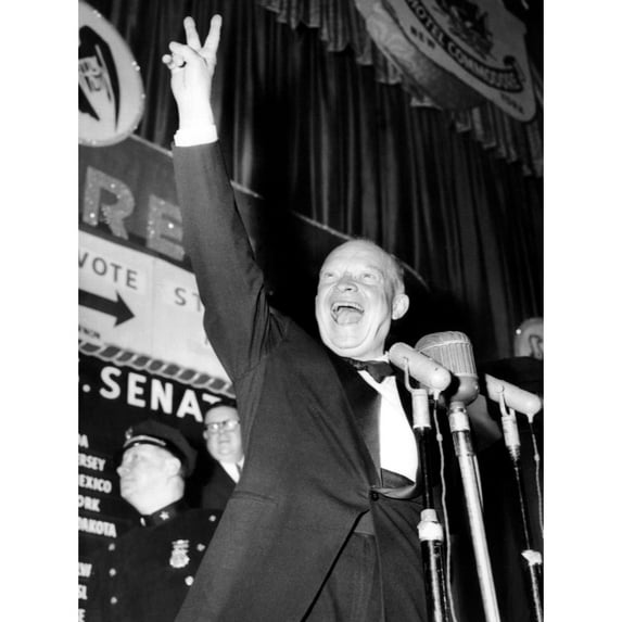 General Dwight D. Eisenhower Flashes A Victory Sign At His Hotel Commodore Campaign Headquarters After Winning The