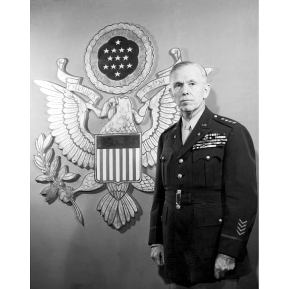 General George C. Marshall Standing In Front Of An Enlarged Ofiicers' Insignia History (24 x 36)