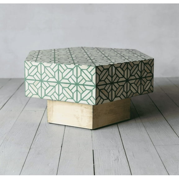 RUDRAKSHA CORPORATION Bone Inlay Coffee Table. It has a hexagon shape and features a green and ivory geometric pattern. This piece is perfect for living room furniture.