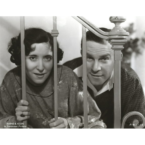 George Burns and Gracie Allen behind a banister Photo Print (24 x 30)