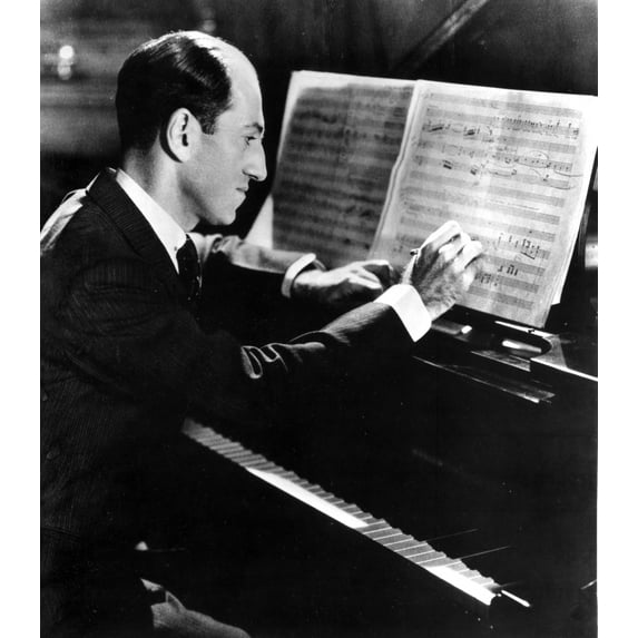 George Gershwin writing at his piano Photo Print (8 x 10)
