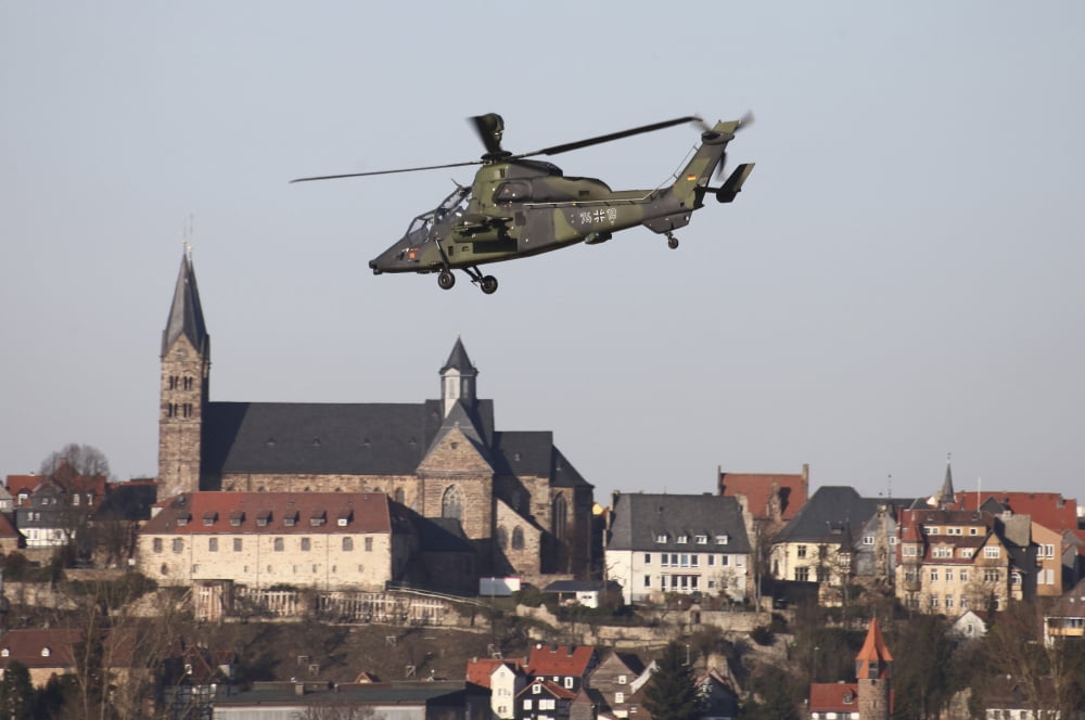 German Tiger Eurocopter flying over the town of Fritzlar Germany Canvas Art - Timm ZiegenthalerStocktrek Images (18 x 12)
