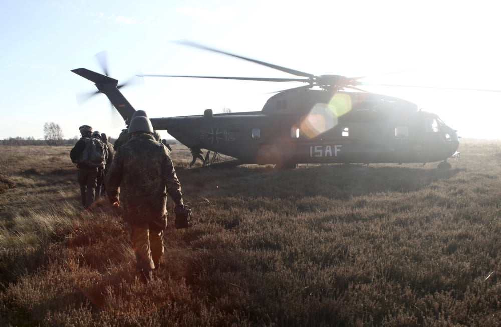 German soldiers boarding a German CH-53GS helicopter Canvas Art - Timm ZiegenthalerStocktrek Images (18 x 12)
