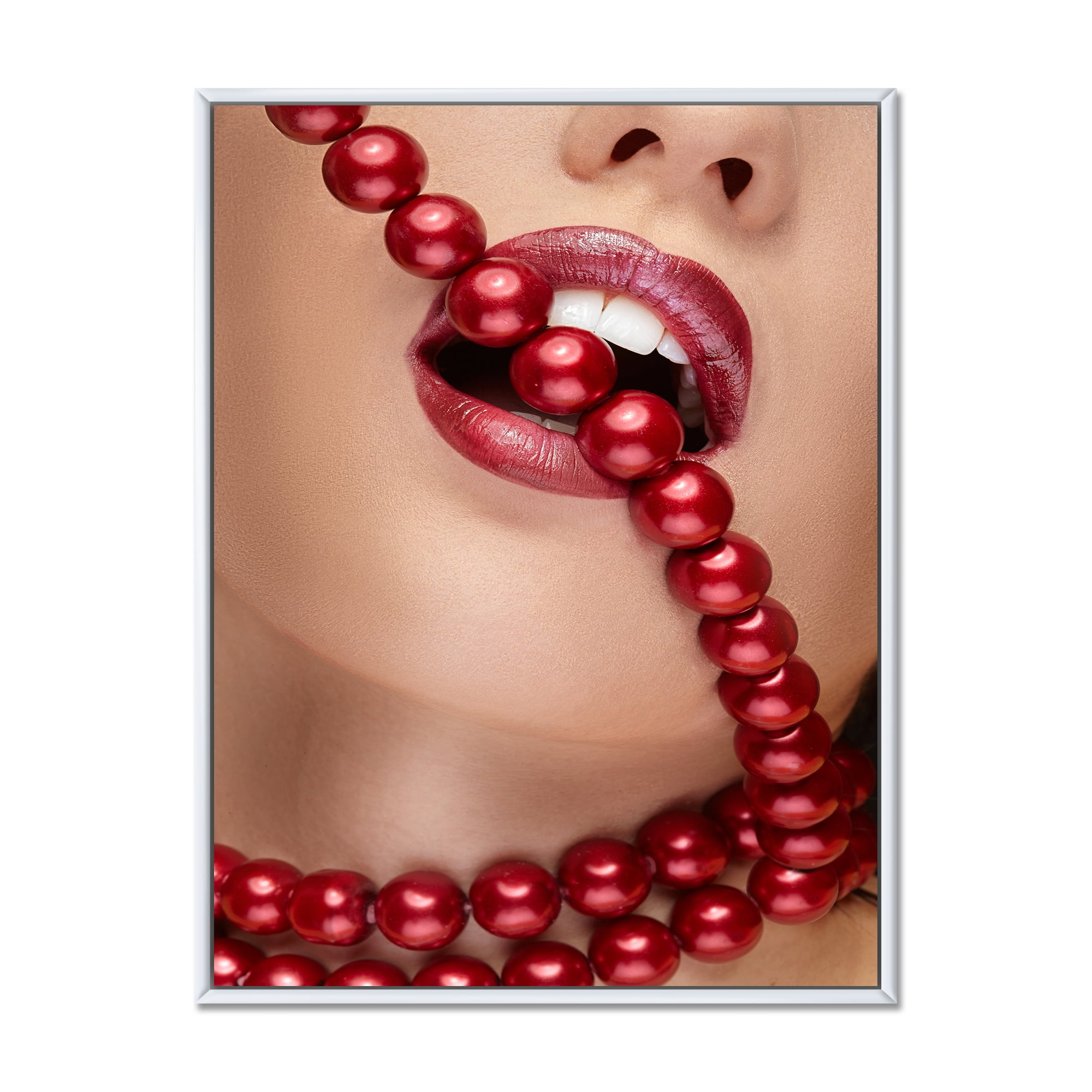 Girl Mouth With Red Lipstick Biting Red Pearls 24 in x 32 in Framed Photography Canvas Art Print, by Designart