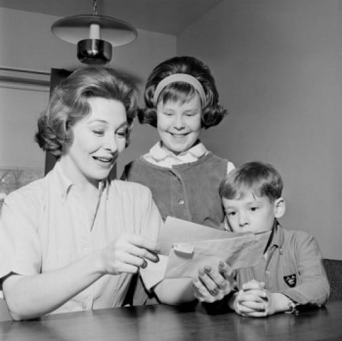 Girl and boy are watching as cheerful mother is reading letter Canvas Art - (18 x 24)