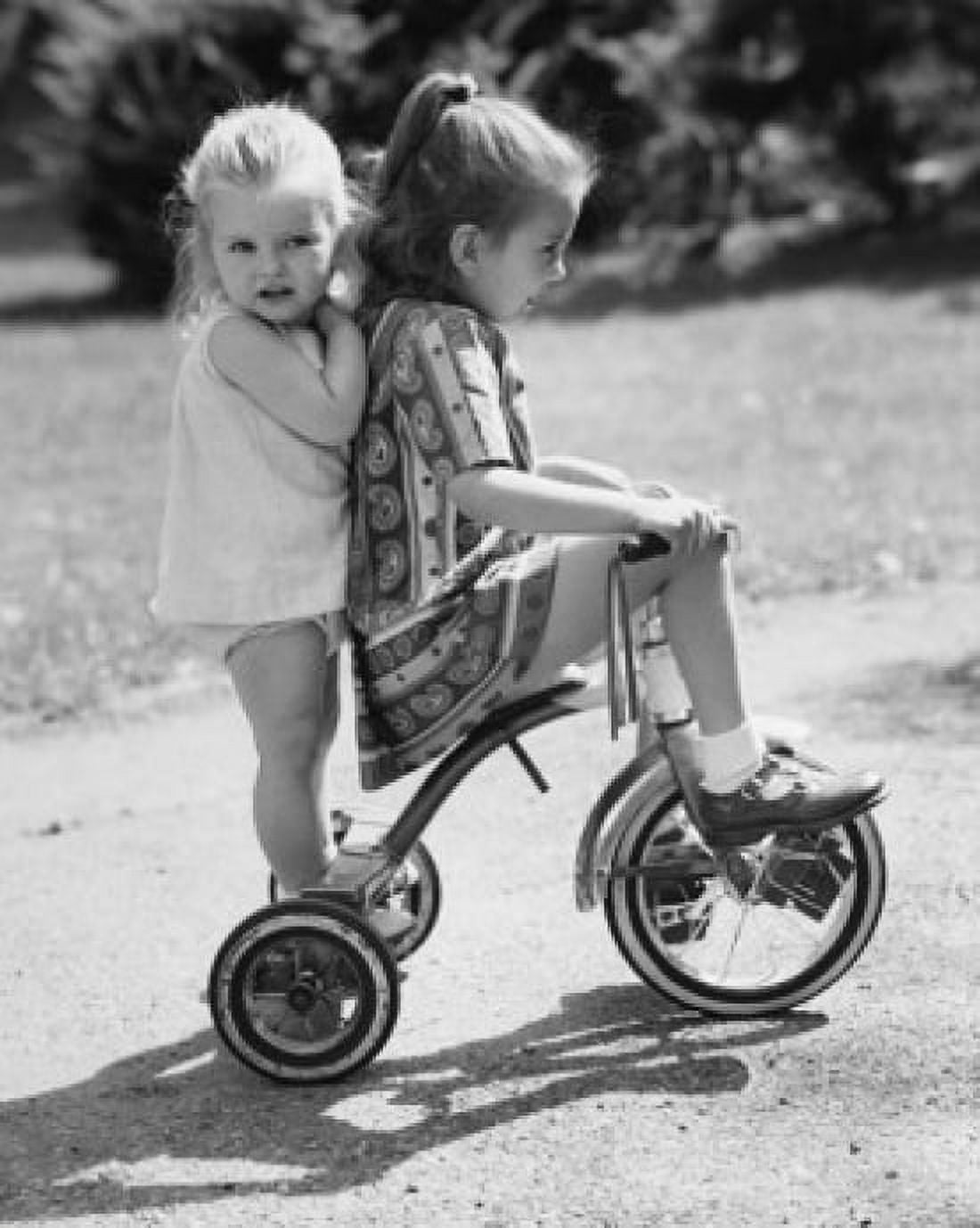 Girl and her sister riding tricycle Canvas Art - (18 x 24)