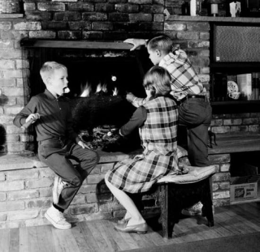 Girl and two boys in front of fireplace Canvas Art - (24 x 36)