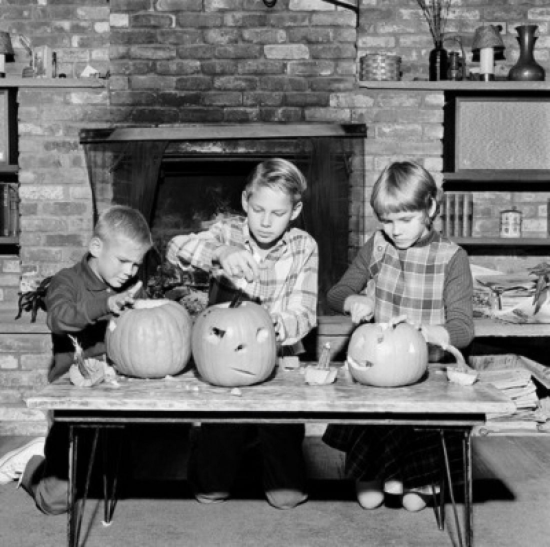 Girl and two boys preparing Jack O Lantern for Halloween Canvas Art - (24 x 36)