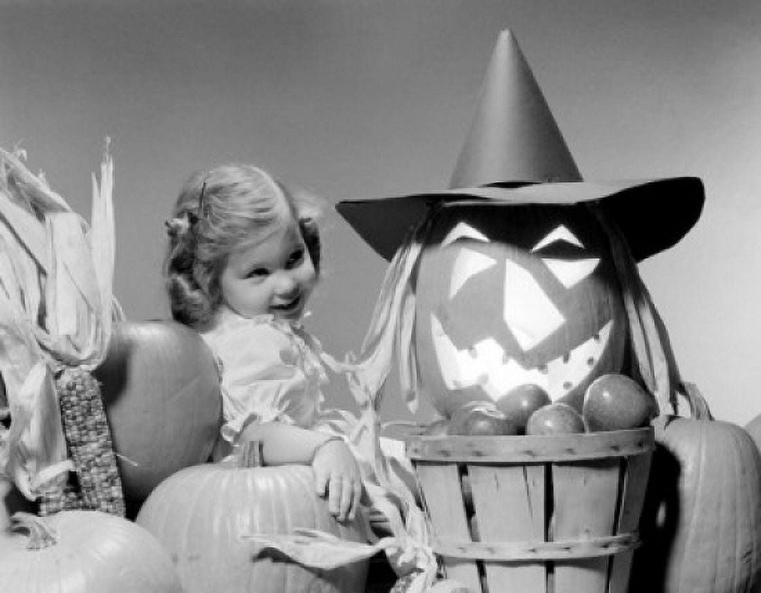 Girl around Halloween decorations studio shot Canvas Art - (24 x 36)