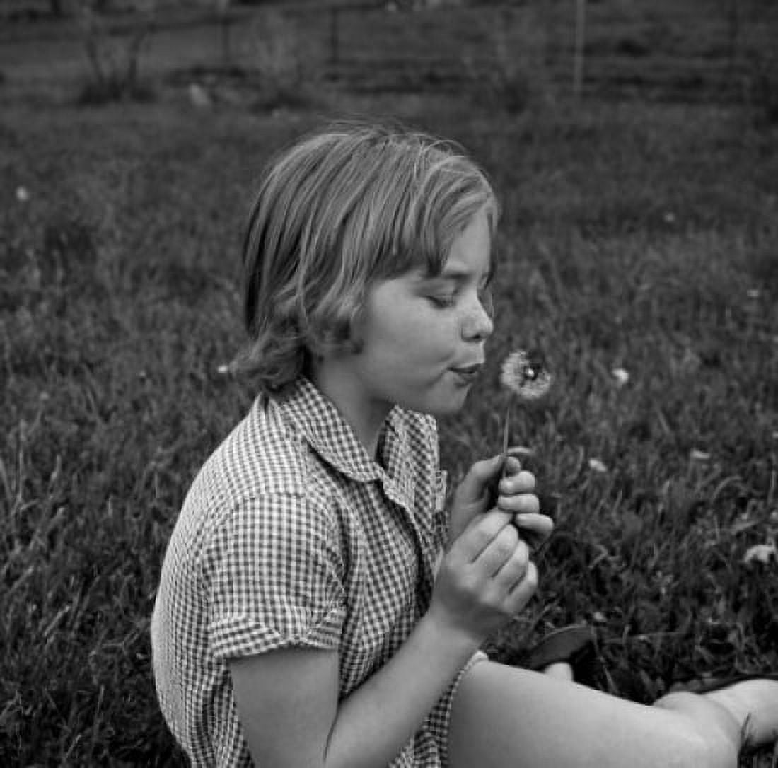 Girl blowing seeds of dandelion Canvas Art - (24 x 36)