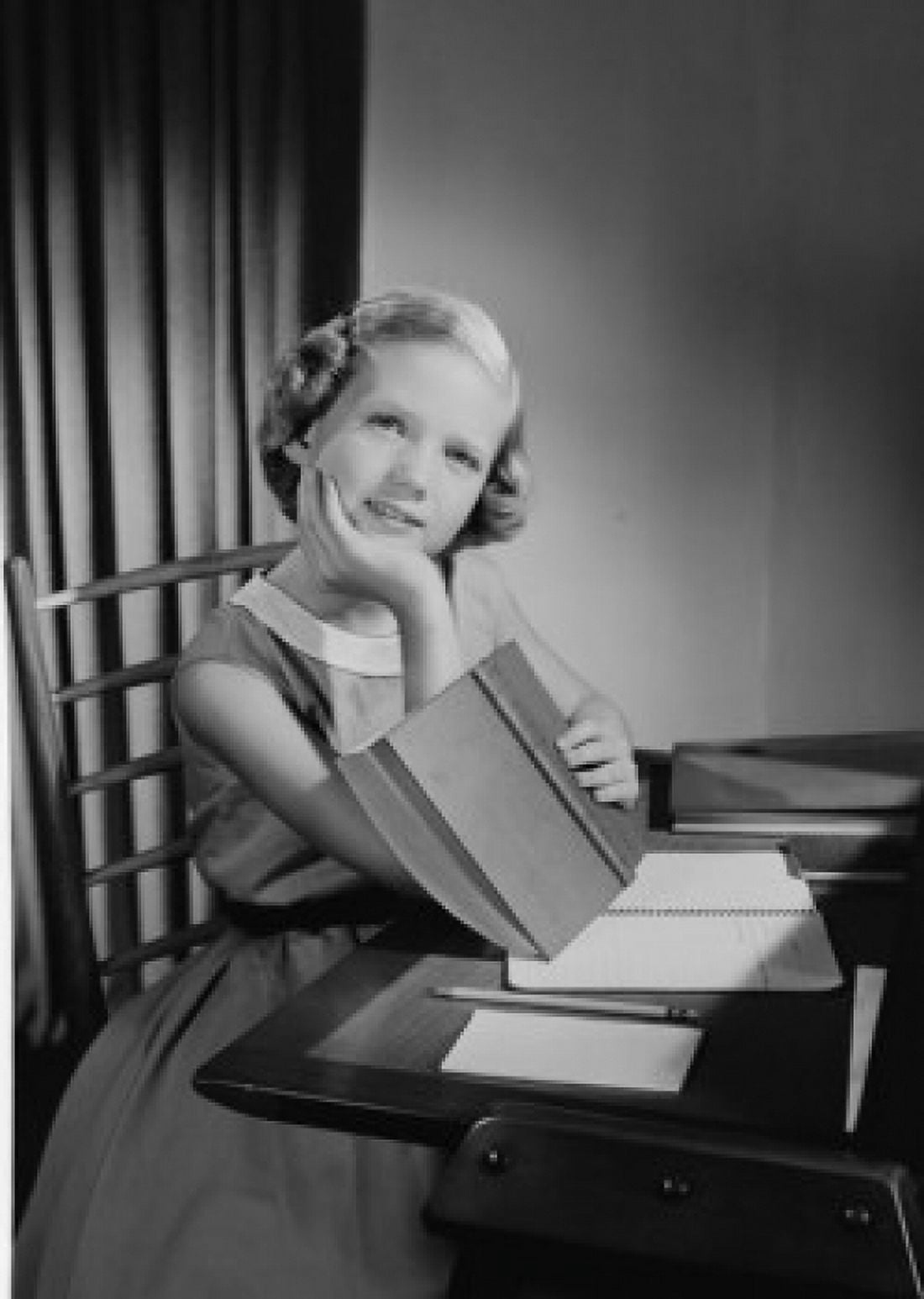 Girl doing homework at desk Canvas Art - (18 x 24)