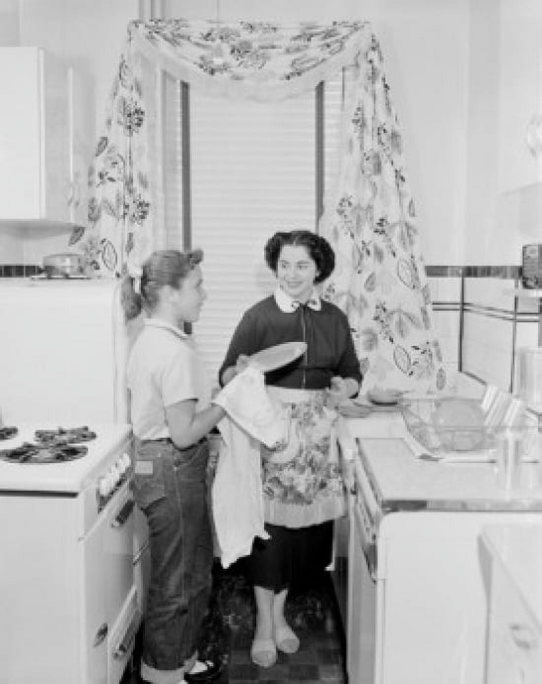 Girl drying dishes with mother in kitchen Canvas Art - (18 x 24)