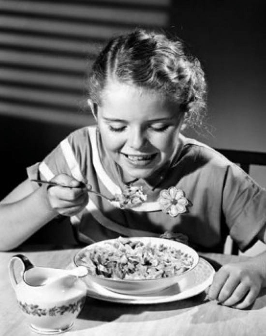 Girl eating corn flakes and smiling Canvas Art - (24 x 36)