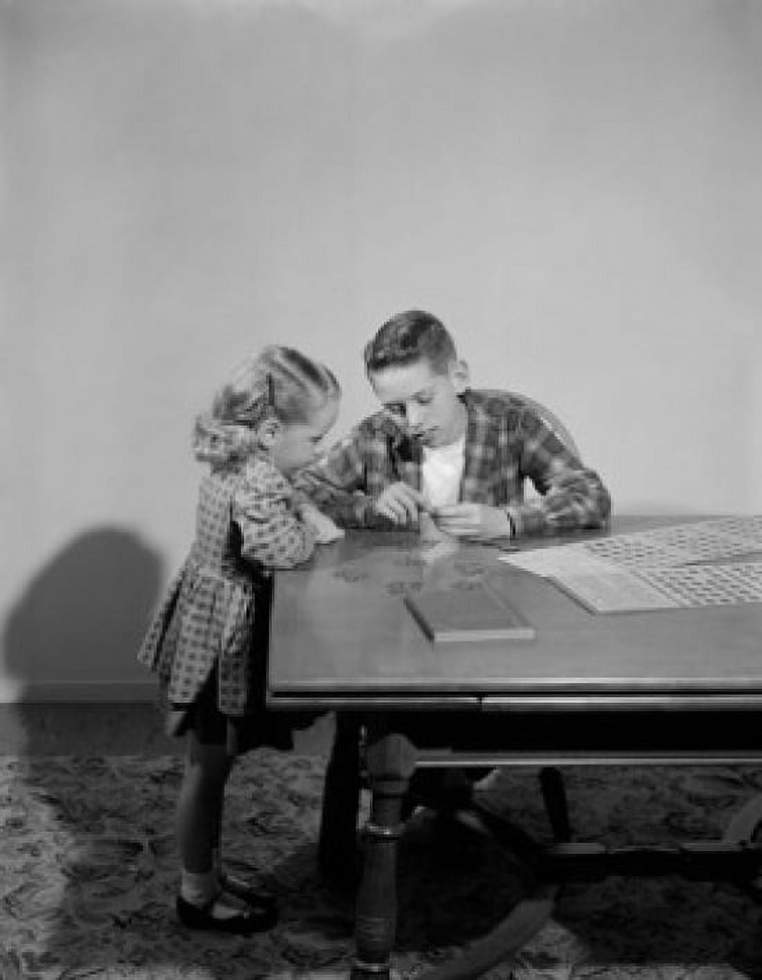 Girl examining collectable post stamps Canvas Art - (24 x 36)