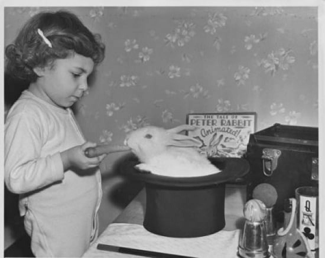 Girl feeding a rabbit in a magicians hat Canvas Art - (24 x 36)