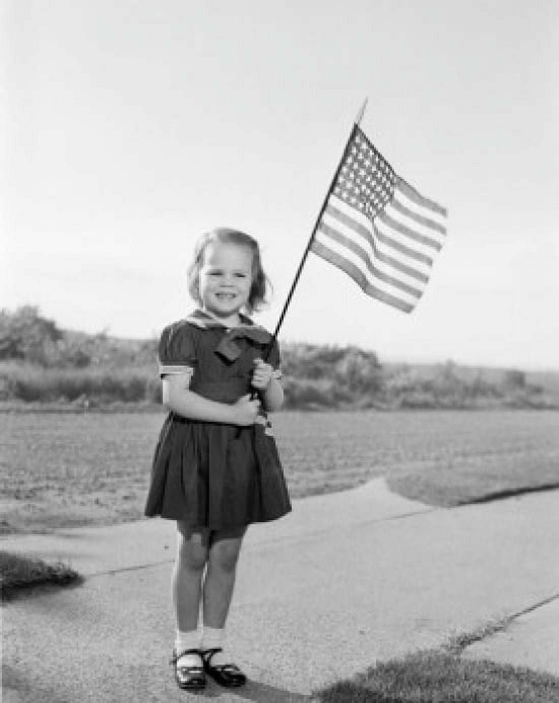 Girl holding US flag Canvas Art - (24 x 36)