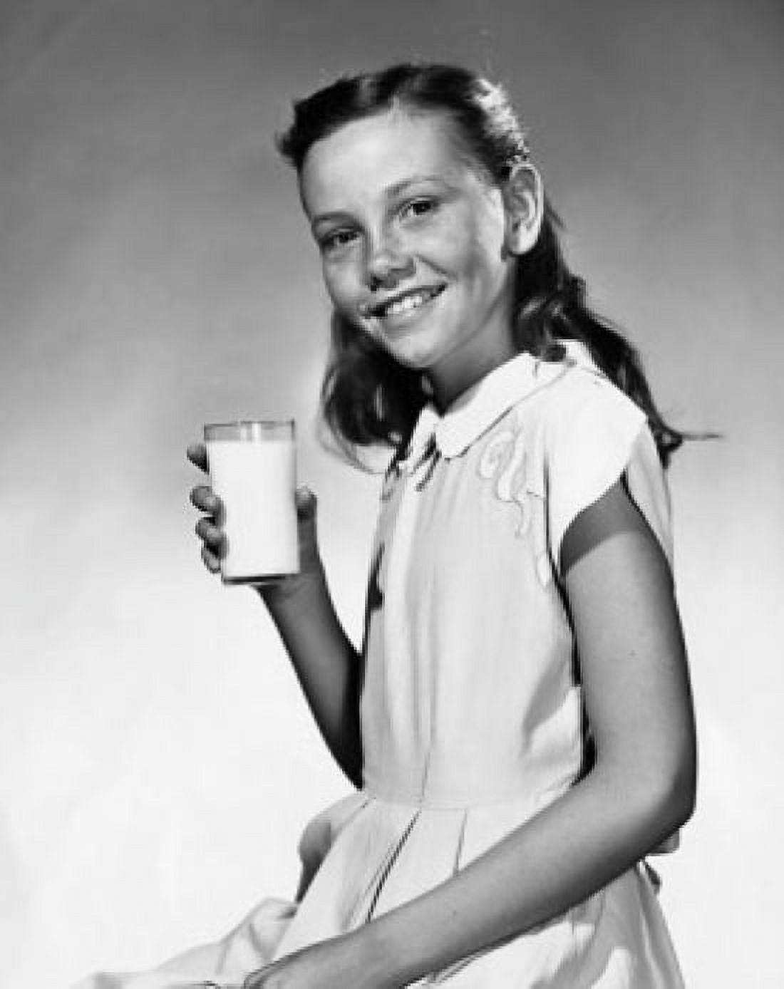 Girl holding a glass of milk and smiling Canvas Art - (24 x 36)