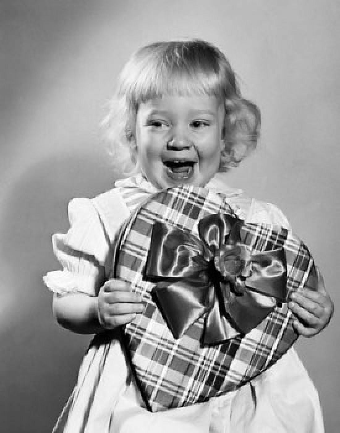 Girl holding a valentine and laughing Canvas Art - (24 x 36)