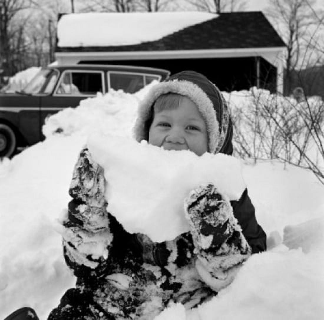 Girl holding pile of snow portrait Canvas Art - (24 x 36)