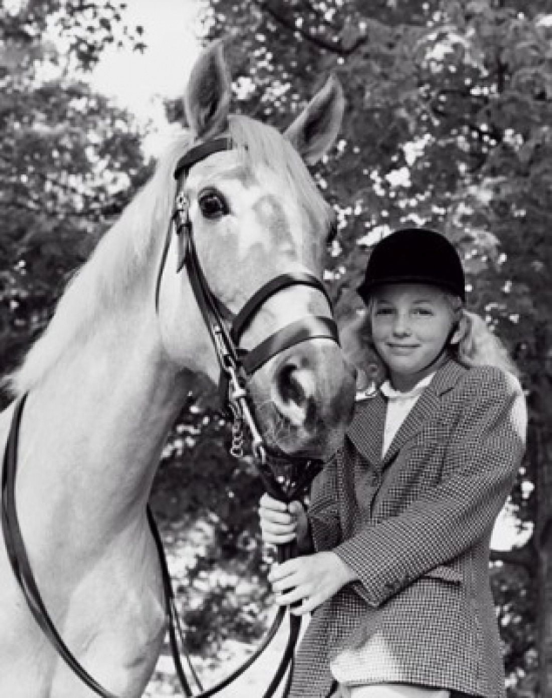 Girl holding the reins of a horse Canvas Art - (18 x 24)