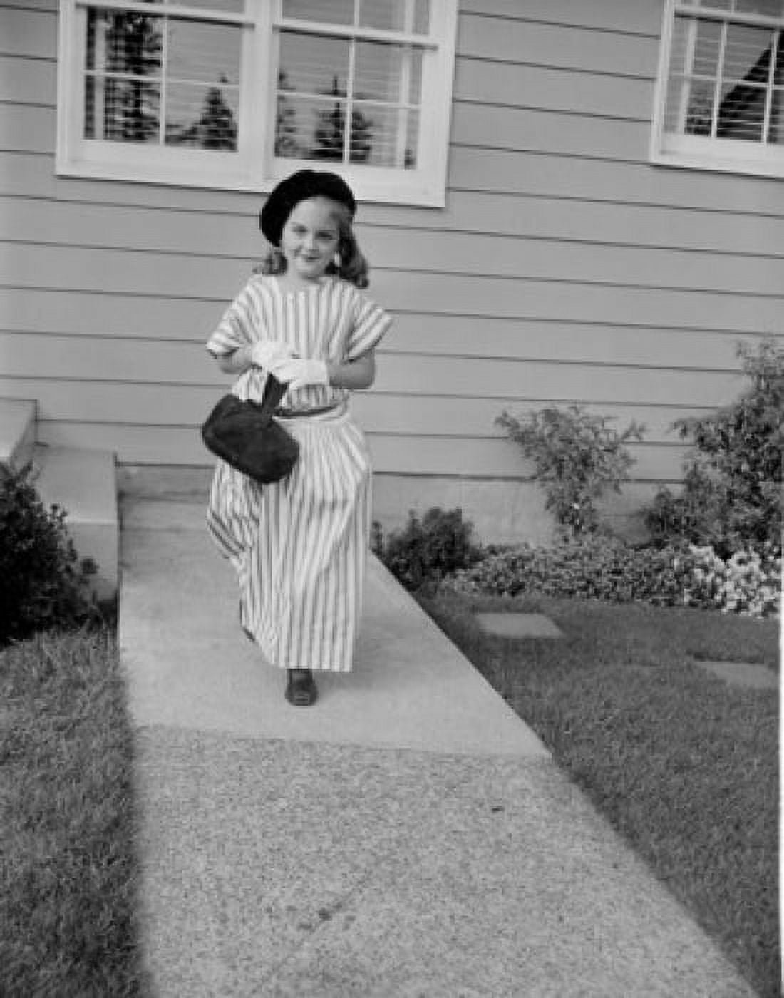 Girl in evening wear walking down backyard path Canvas Art - (24 x 36)