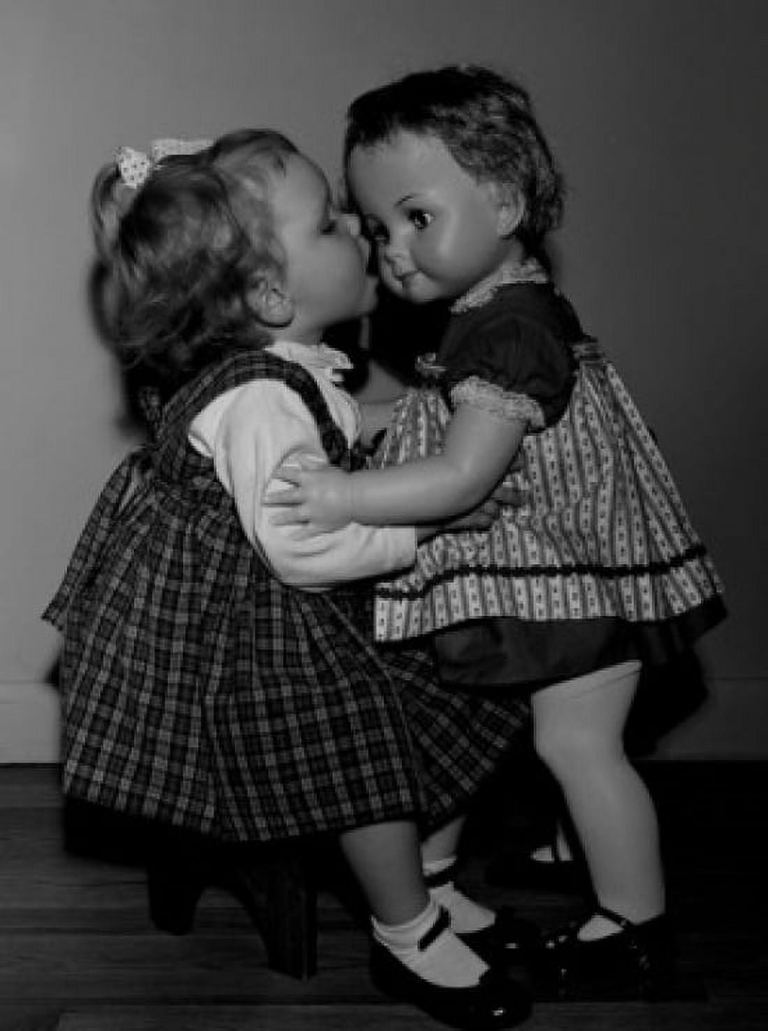 Girl kissing doll Canvas Art - (24 x 36)