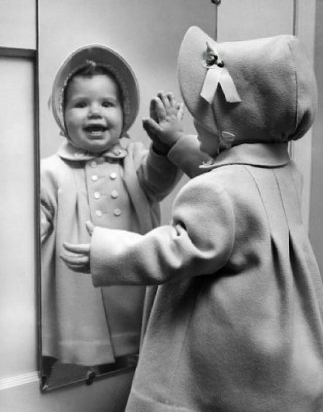 Girl looking at her reflection at mirror and laughing Canvas Art -  (24 x 36)