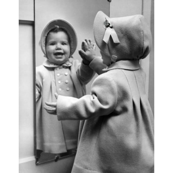 Girl looking at her reflection at mirror and laughing Poster Print (24 x 36)
