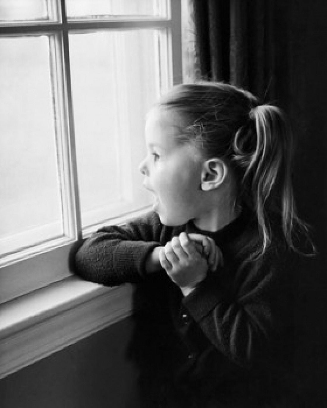 Girl looking through a window Canvas Art - (24 x 36)