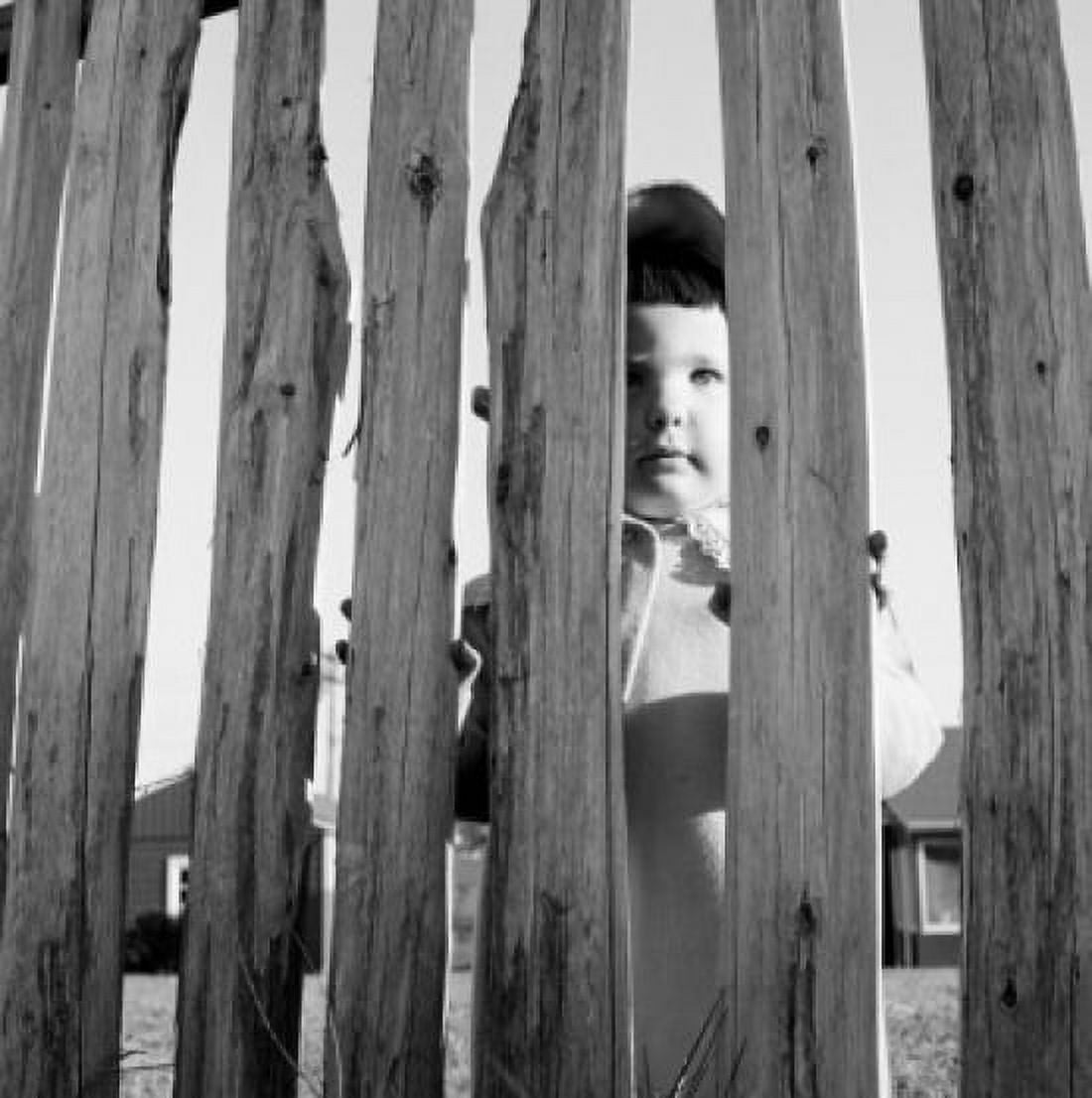 Girl looking through fence Canvas Art - (24 x 36)