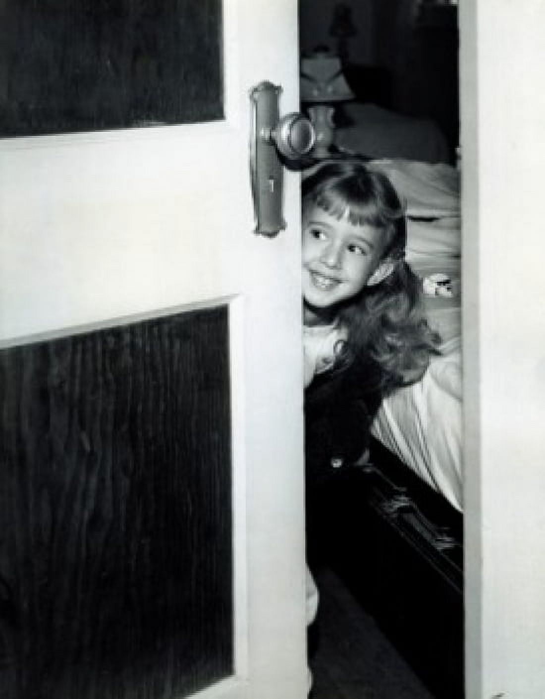 Girl peering around bedroom door Canvas Art - (24 x 36)