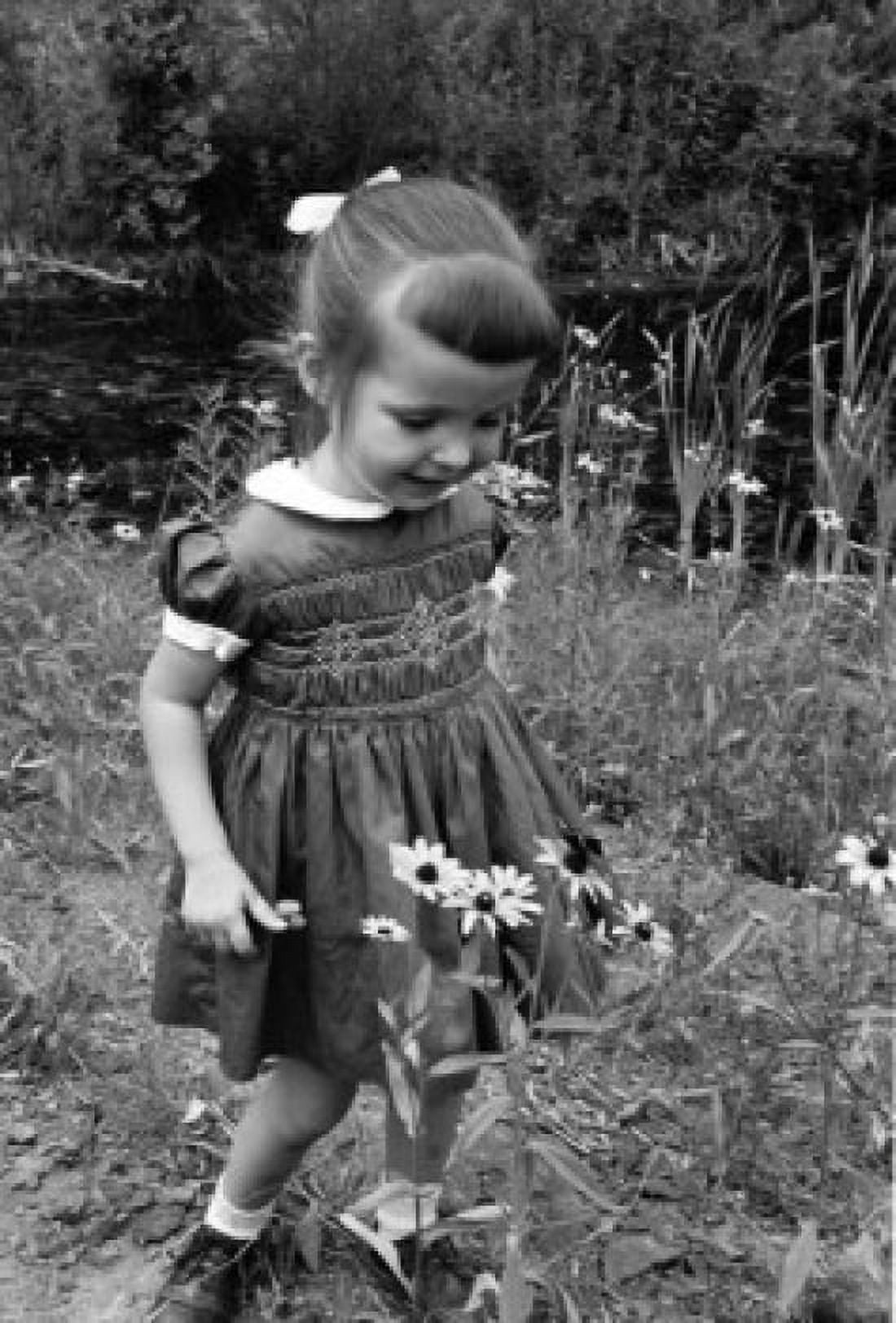 Girl picking up daises Canvas Art - (18 x 24)