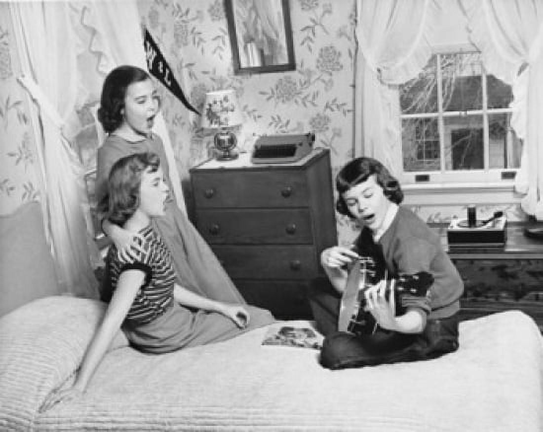 Girl playing a guitar with two girls singing with her Canvas Art - (18 x 24)