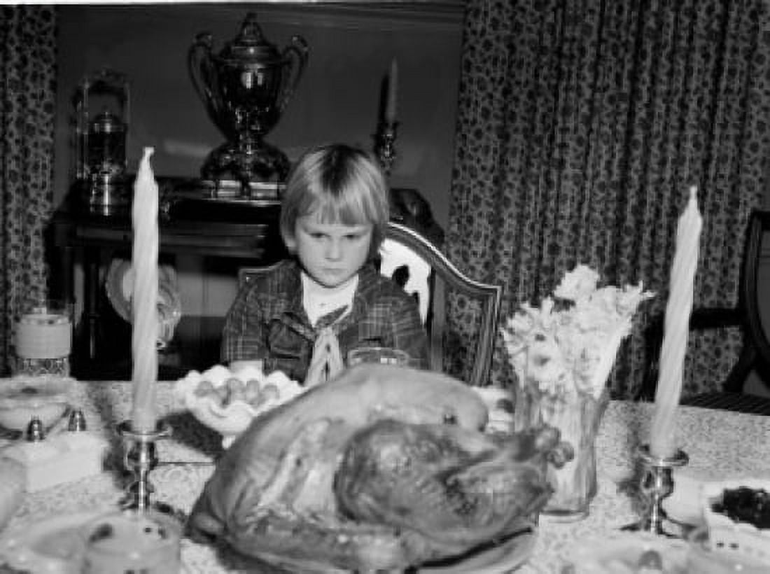 Girl praying before Thanksgiving meal Canvas Art - (18 x 24)