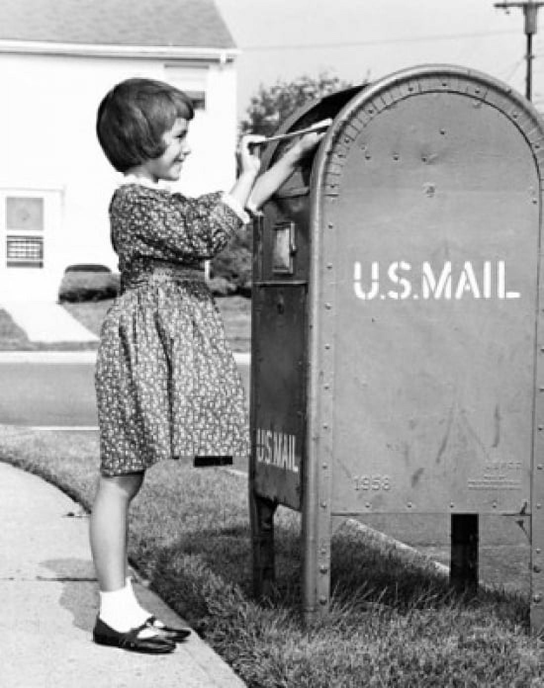 Girl putting a letter into a mailbox Canvas Art - (18 x 24)