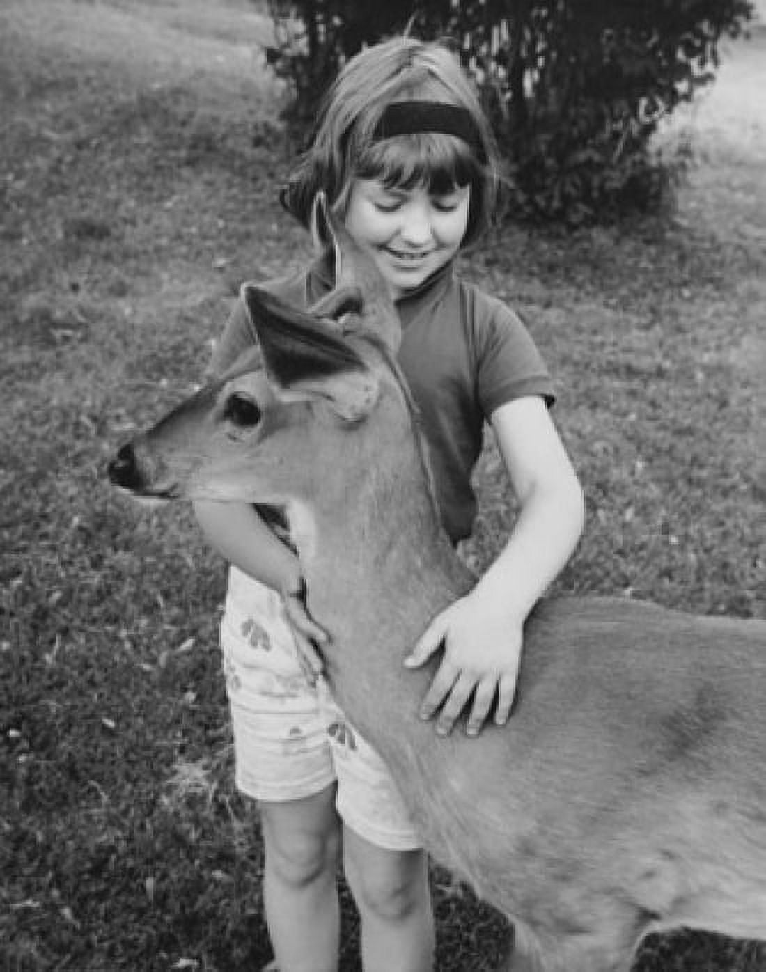 Girl stroking fawn Canvas Art - (24 x 36)