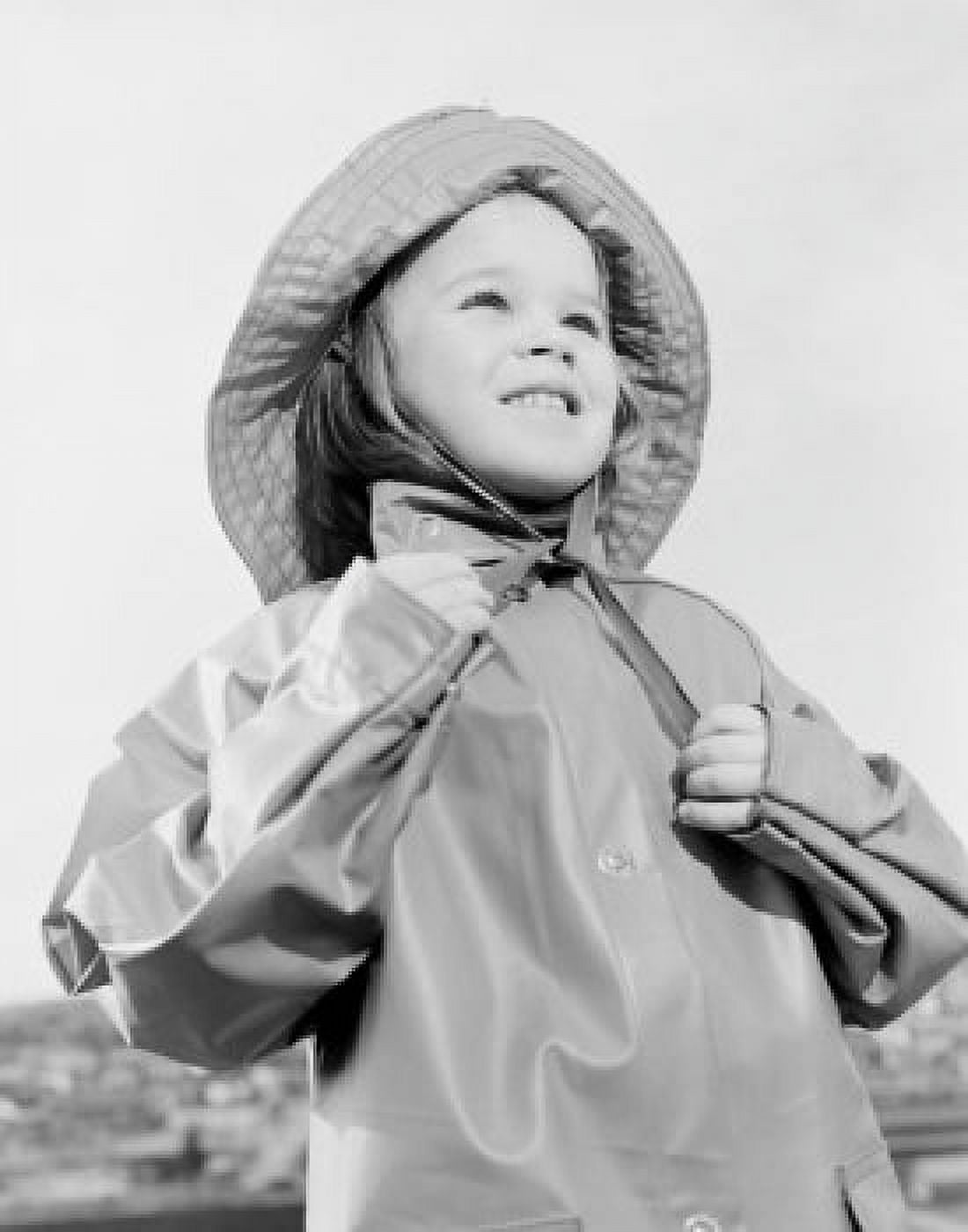Girl wearing raincoat and rain hat Canvas Art - (24 x 36)