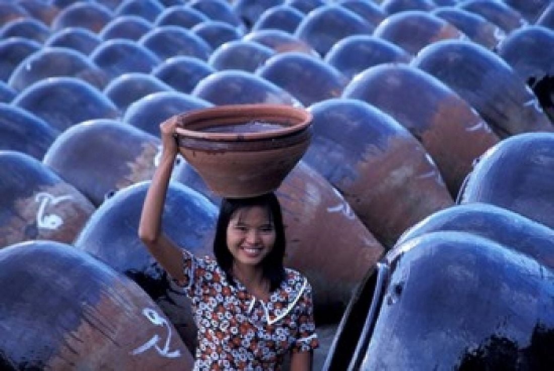 Girl with Pottery Jars Myanmar Canvas Art - Keren Su DanitaDelimont (24 x 15)