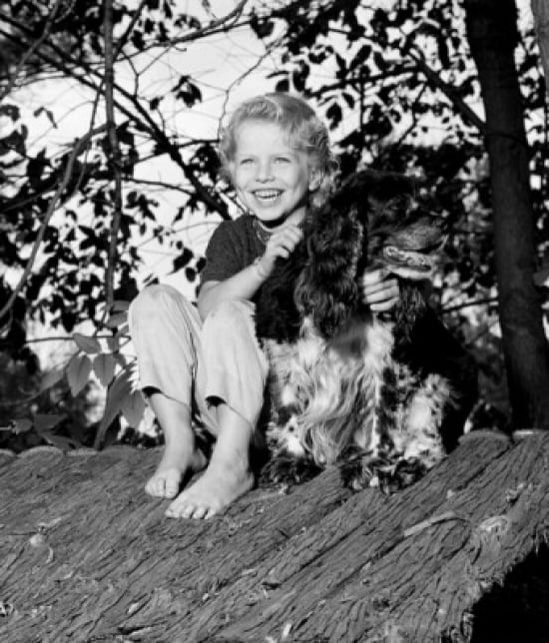 Girl with dog sitting on shed roof Canvas Art - (24 x 36)