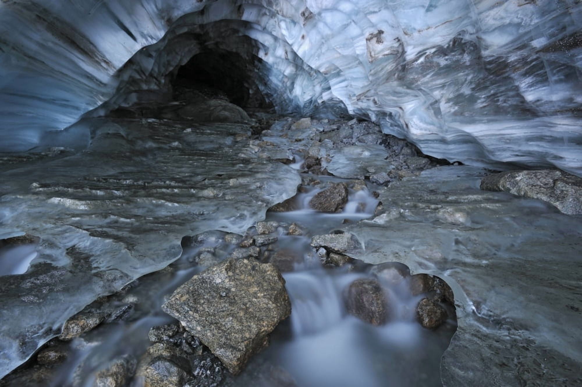 Glacial Creek Flowing From Blue Ice Cave In Britnell Glacier Nahanni National Park Northwest Territories Canvas Art - Peter Mather Design Pics (17 x 11)