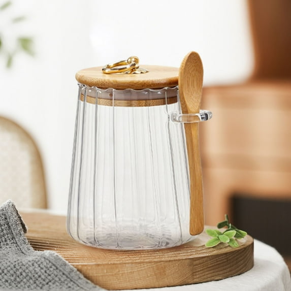 Glass Tea Storage Jar with Spoon Airtight Container for Loose Leaf Tea and Dry Food Pantry Organizer Clear Canister for Kitchen Countertop Modern Design with Secure Lid for Preserving Freshness